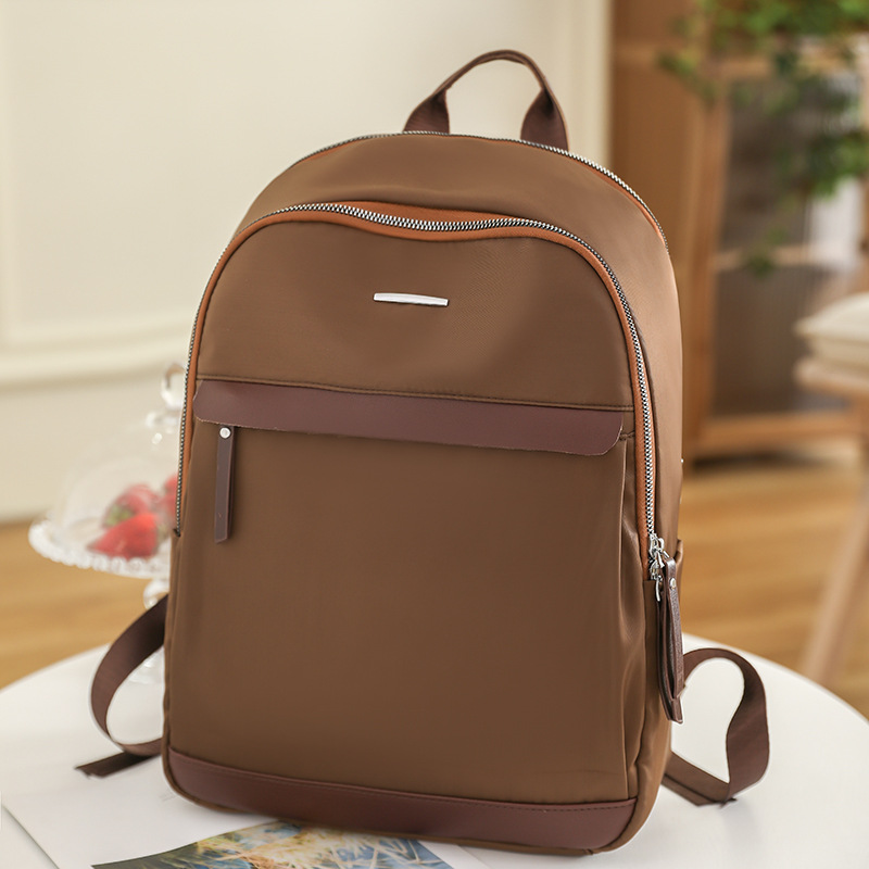 Fábrica al por mayor 2023 nueva mochila de tela Oxford para mujer retro casual de gran capacidad de 14 pulgadas para mujer