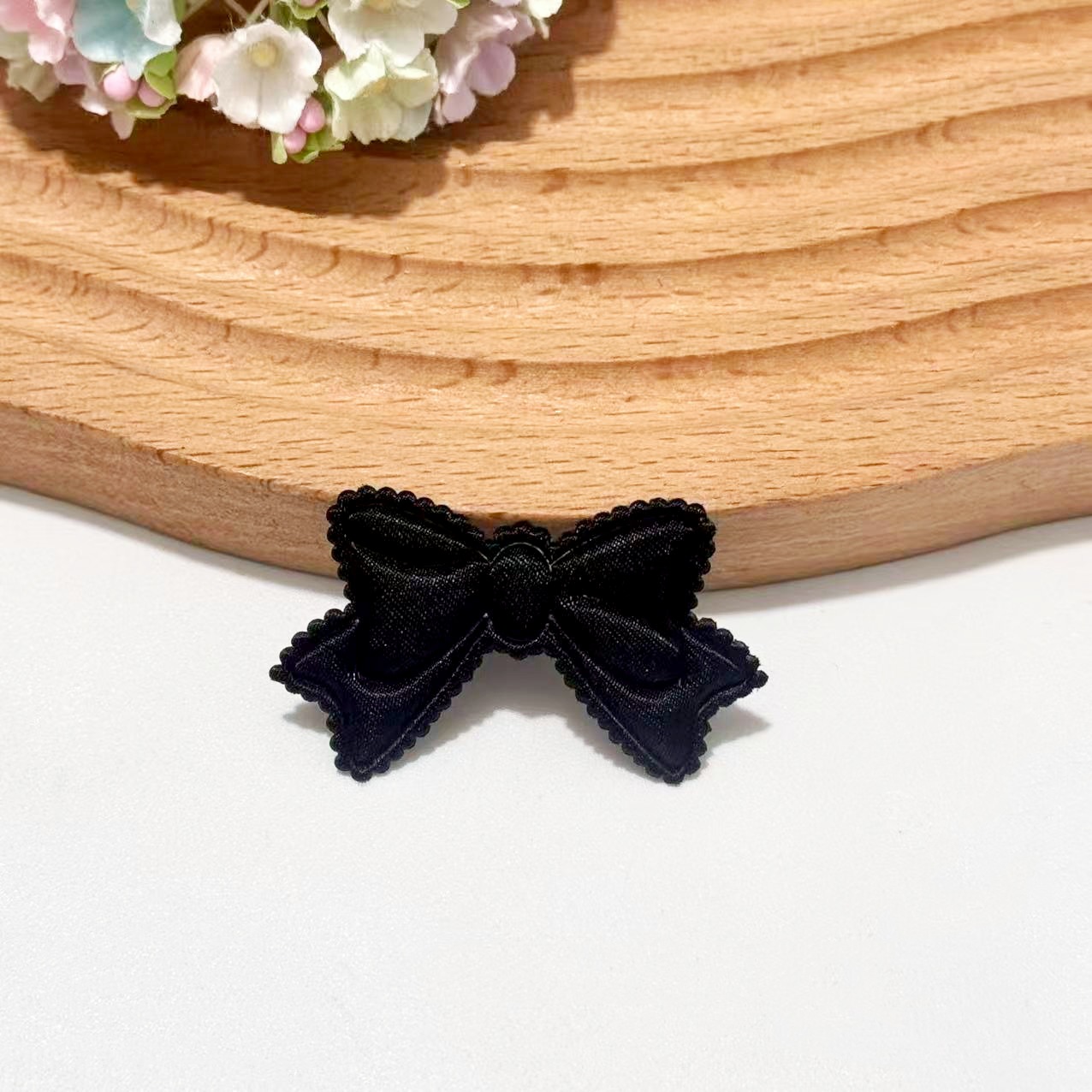 With bow, black