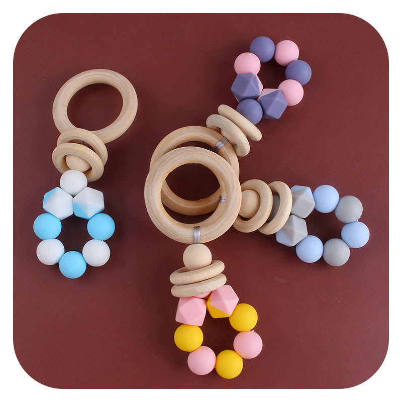 Nuevos suministros para bebés DIY creativo anillo de madera mordedor bebé calmante de dos colores de silicona de juguete dientes de molienda palo