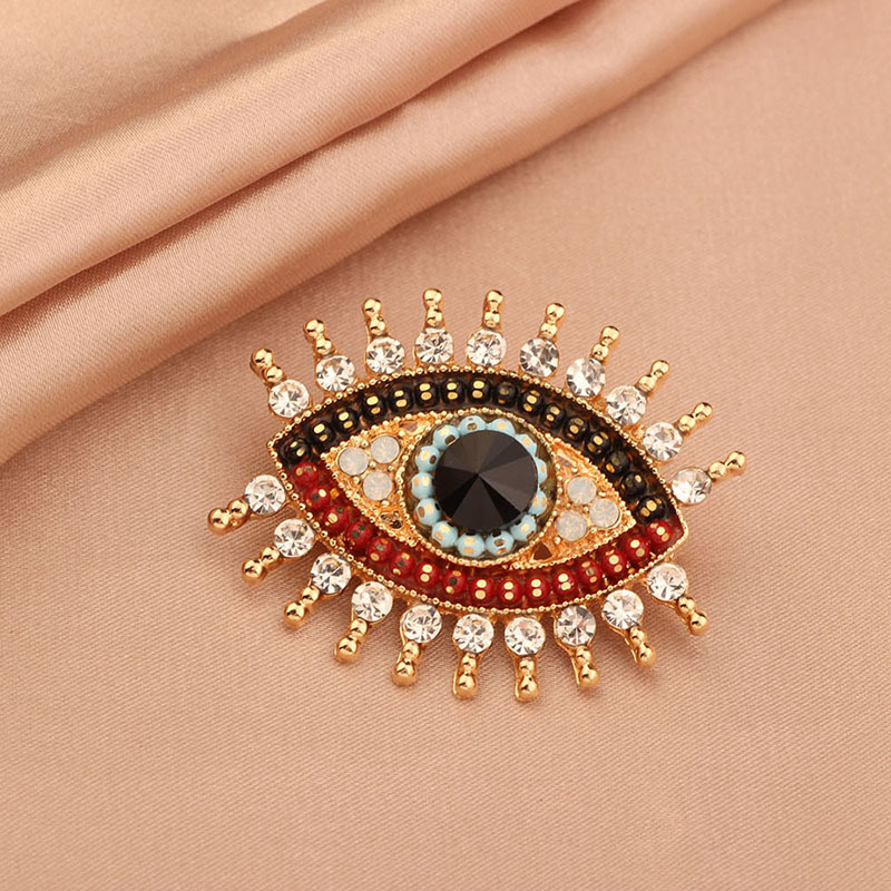 Retro simple Ángel ojo en línea broche de celebridad diamante femenino francés diablo ojo pecho ornamento