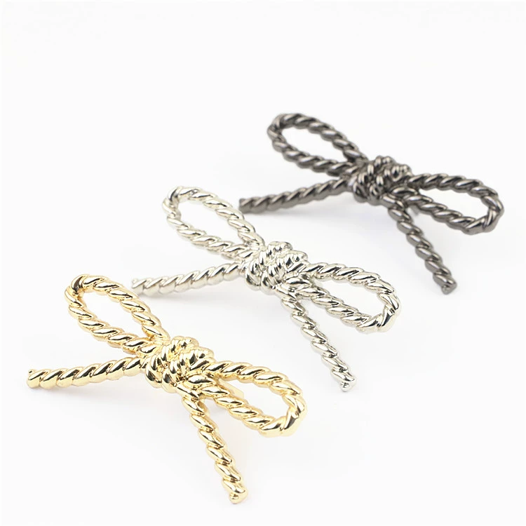 Metal bag accessory with pigtail, footwear buckle with bow, shoes, decorations