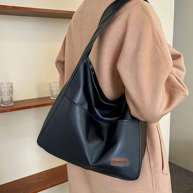 Bolso retro de gran capacidad para mujeres, nuevo bolso de textura, bolso de viaje para estudiantes universitarios, simple bolso de hombro casual.