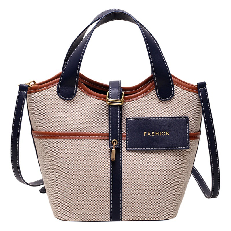 Bolso de lona para mujer 2026, nuevo diseño de nicho, bolso de mano tipo cubo, bolso retro de moda, bolso de hombro cruzado tipo cesta