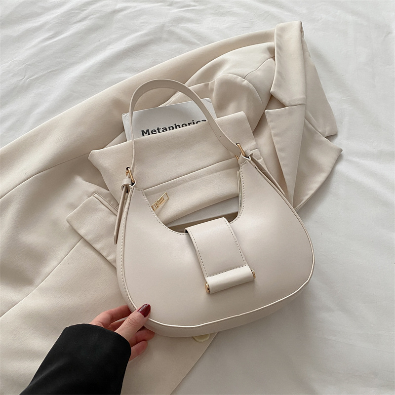 Bolso popular de este año para mujeres 2025, nueva moda de un solo hombro, bolso de diseño de nicho, bolso de media luna debajo de la axila