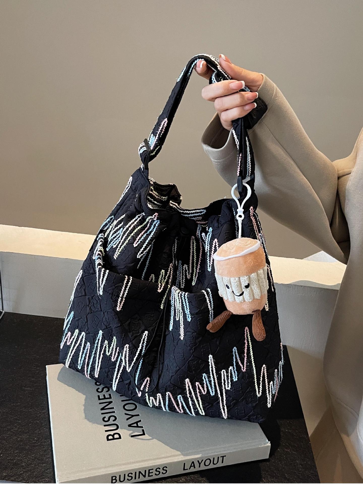 Estilo occidental todo-fósforo bolso de ocio bolso de mensajero mujer 2025 nuevo bolso de cubo de moda simple bolso de lona de viaje para estudiantes