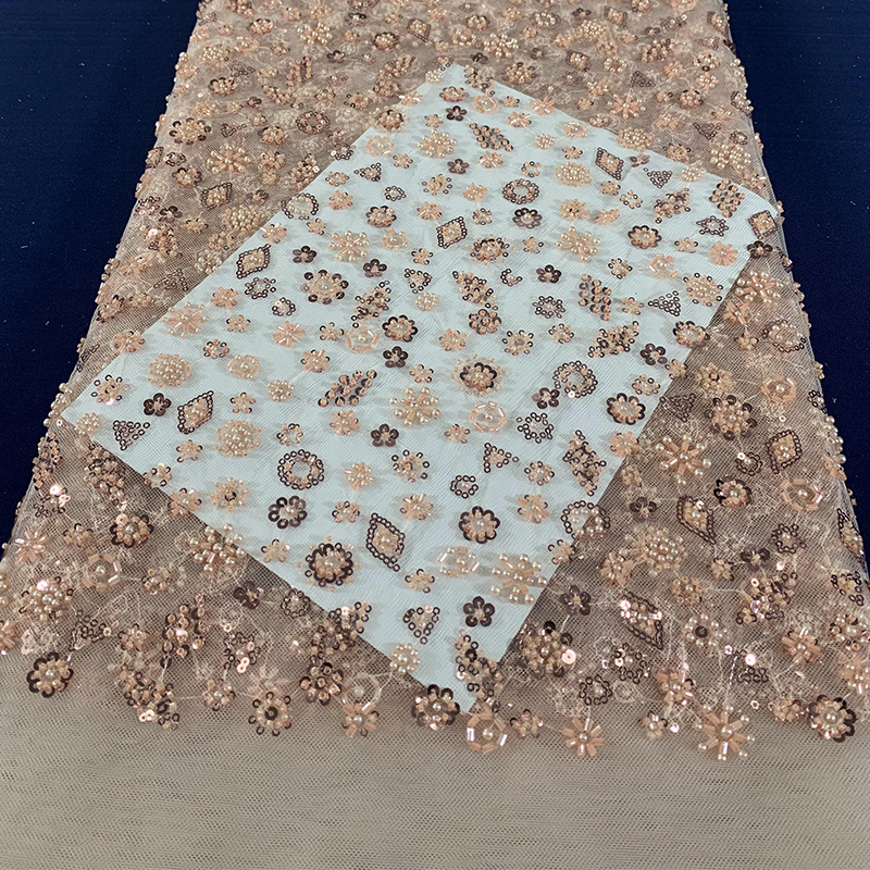 Tejido de bordado de tubo de perlas de lenteja tejido de bordado de malla láser tridimensional tejido de moda de vestido europeo y americano Gaoding
