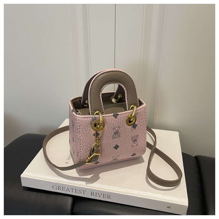 2026 nuevo bolso infantil caricatura lindo oso impresión bolso de hombro de moda mini bolso de bebé