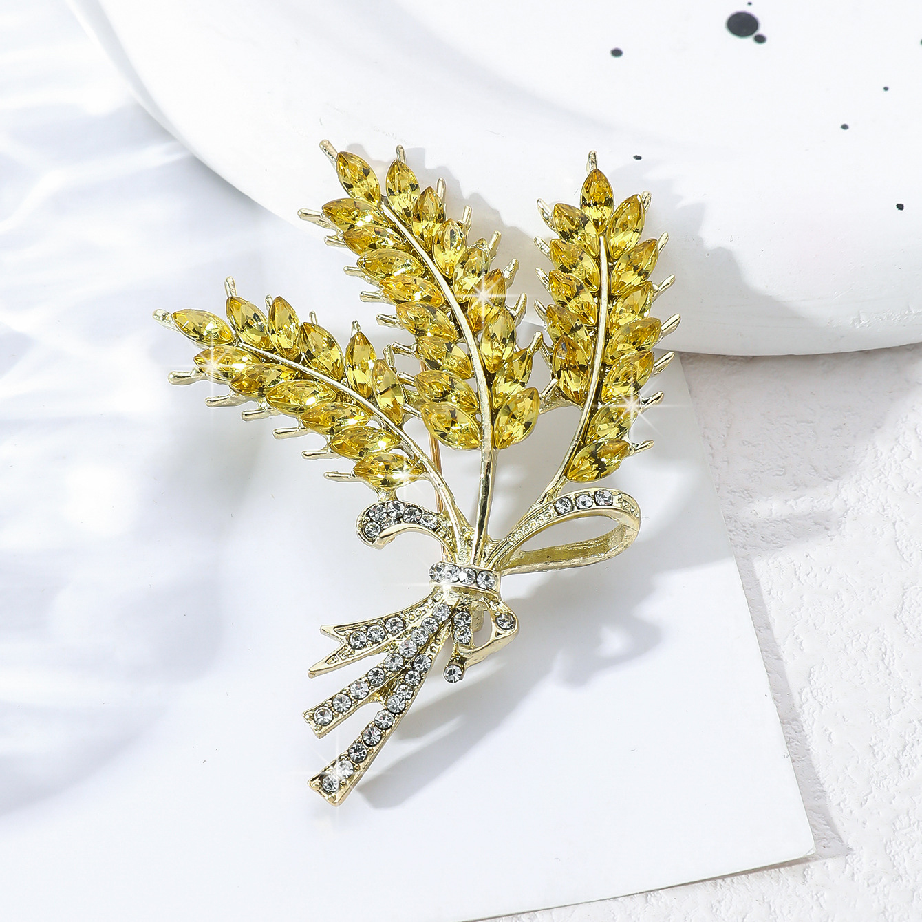 Elite golden brooch