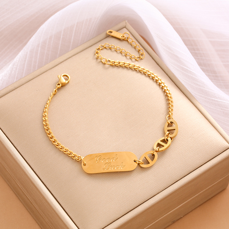 Pulsera de trébol de acero titanium vendedora caliente transfronteriza europea y americana con incrustaciones de concha pulsera colgante pulsera de diseño avanzado sin desvanecimiento al por mayor