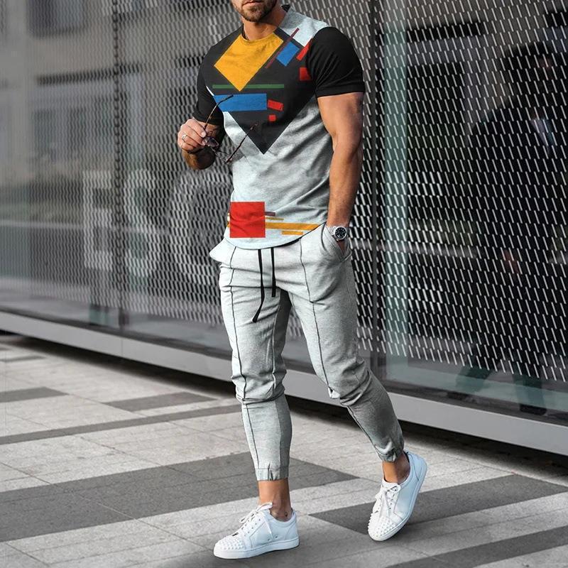 男性のスーツの夏の青年の半袖のtシャツのストライプは色のゆったりした弾力の薄い運動のズボンの2つのセットをつづり合わせます。|undefined