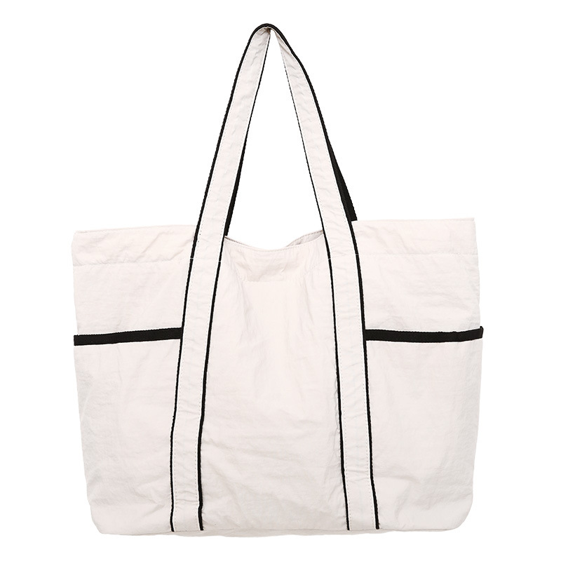 Bolsa de mano de tela de nylon de gran capacidad para mujeres 2026 nueva simple, ligera y versátil bolso de hombro de viaje diario