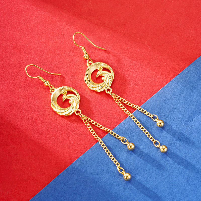 Arena oro gotas para los oídos de las mujeres Phoenix tallado borla pendientes no se desvanece temperamento estilo nacional Phoenix largo retro joyería