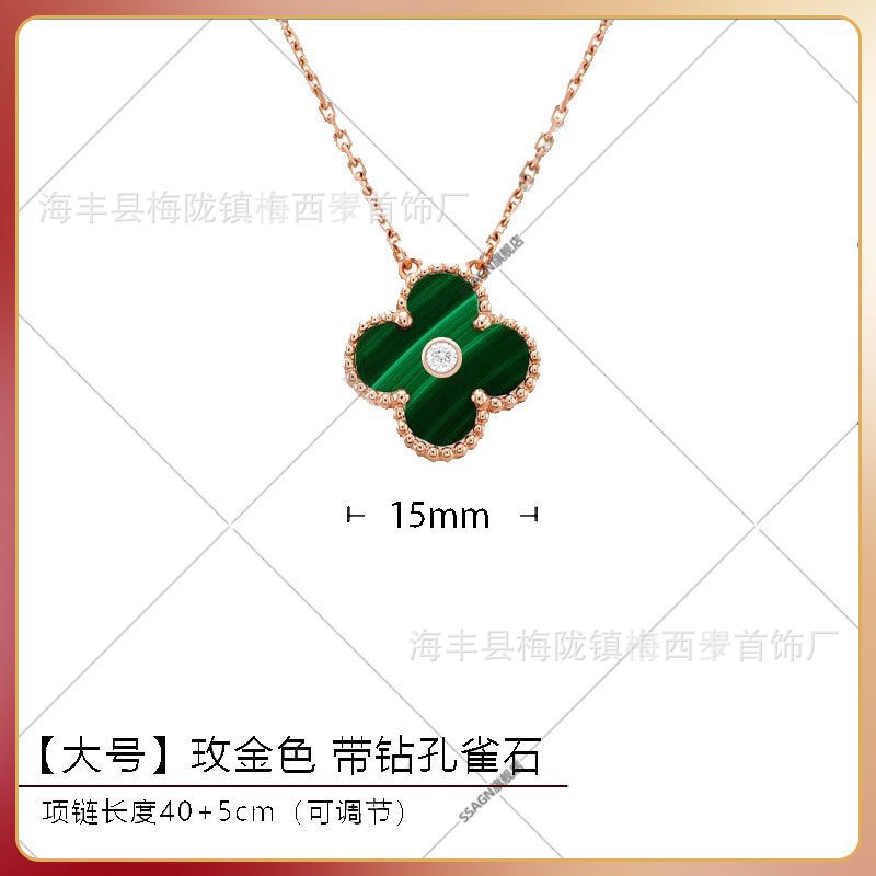 Large four-leaf clover necklace in rose gold with malachite and diamonds in the middle