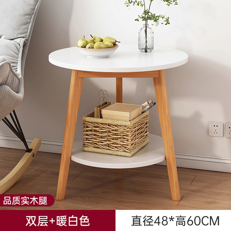 Sofá de la sala de estar pequeña mesa redonda doméstica, estante de cabecera de cama moderno y minimalista, mesa de té creativa con balcón