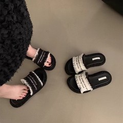 スリッパの女性2025年夏の新型の平底の丸い頭の厚い底の1字は百合を引きずって外に小さい香風の涼しいスリッパの女性を着ます。