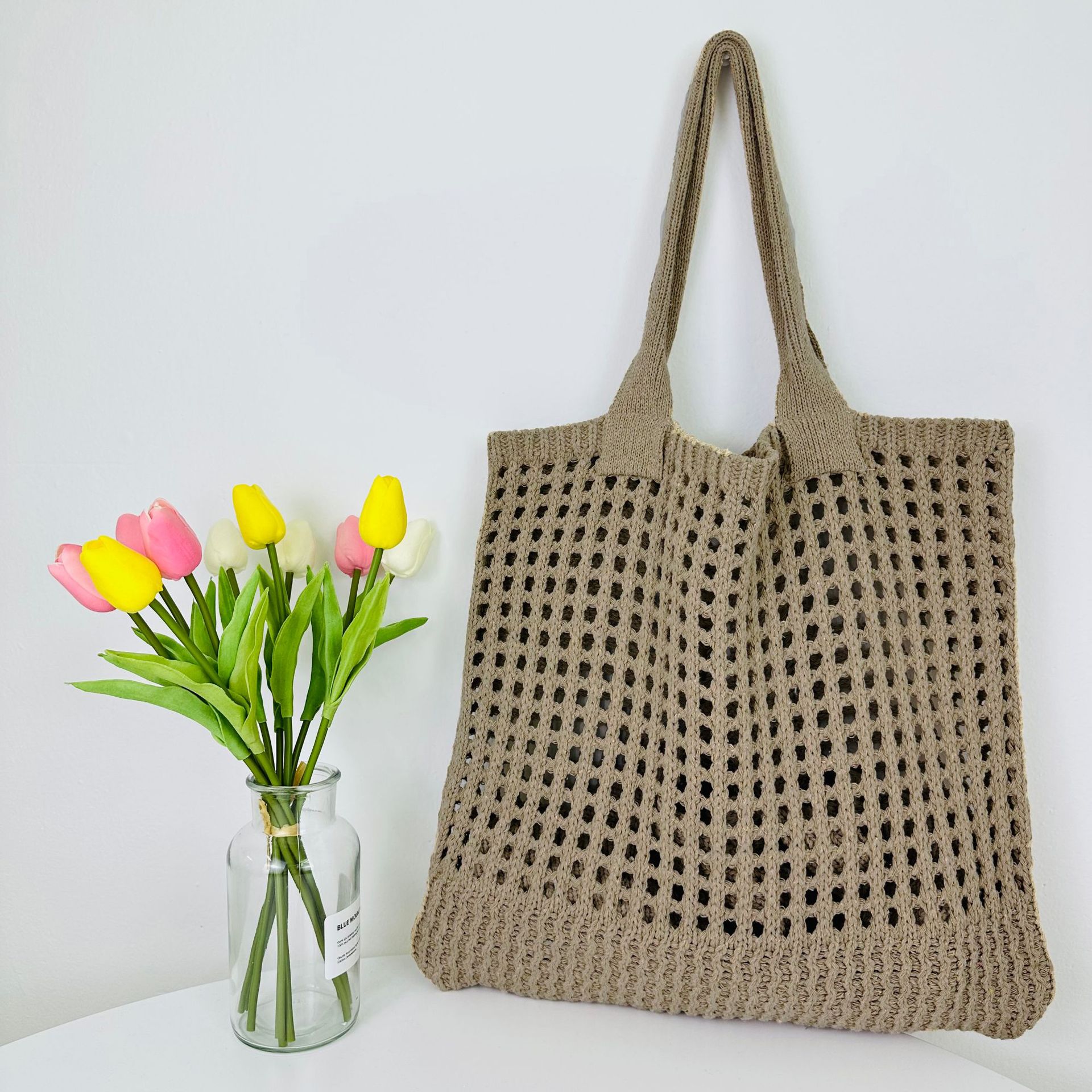 2023 nueva bolsa transfronteriza bolso de mano japonés y coreano bolsa de color sólido bolsa de punto bolsa hueca bolsa de hombro bolsa tejida