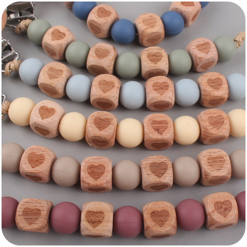 Nueva Cadena de chupete de cuentas de silicona Patrón de corazón de haya calmante para bebés Cuentas de haya Cadena de chupete de silicona cadena anti-caída