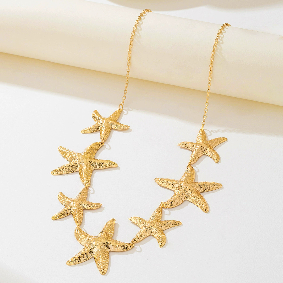 Moda europea y americana, retro transfronterizo, elegante serie oceánica, serie de metal, colgante de estrella de mar, cadena de cintura para mujer