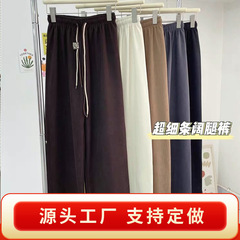 コーデュロイの超細いフリースのワイドパンツの女性の秋の新型のダブルロープの笑顔のベルトのカジュアルなズボンの高腰のストレートパンツ
