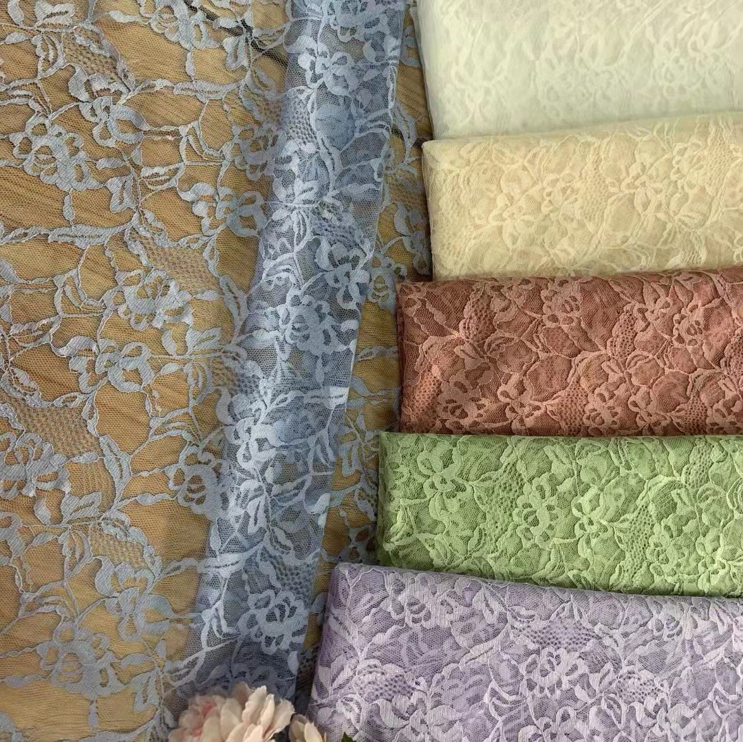 春夏热卖款~多色现货供应涤纶无弹薄透大花提花蕾丝 仙美裙装面料