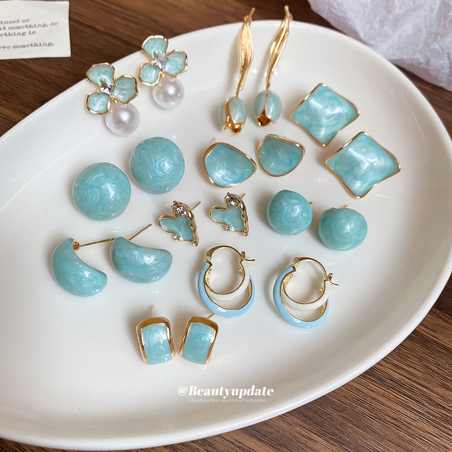 Pendientes de borla de flores de tulipán de aceite de goteo de aguja de plata Primavera/verano 2025 Pendientes nuevos de nicho de alta gama al por mayor