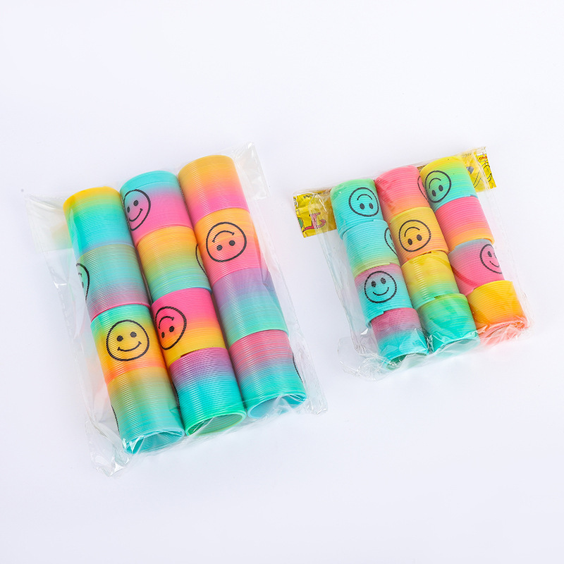 子供の魔力の虹の輪の表情の笑顔の虹のスプリングの輪の露店の弾力の積み重ねの輪の知育のノスタルジックなおもちゃ|undefined