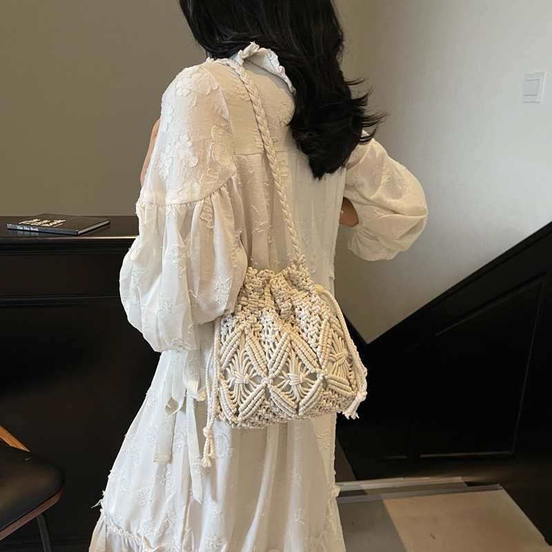 2025 verano nueva moda moda popular mochila de hombro de vacaciones de playa de viaje de playa bolsa de balde de tejido