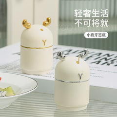 新しい鹿のボタン式のつまようじの筒は自動的に高級な個性のアイデアのかわいい高い顔の値のネットの赤いつまようじの缶を飛び出します。