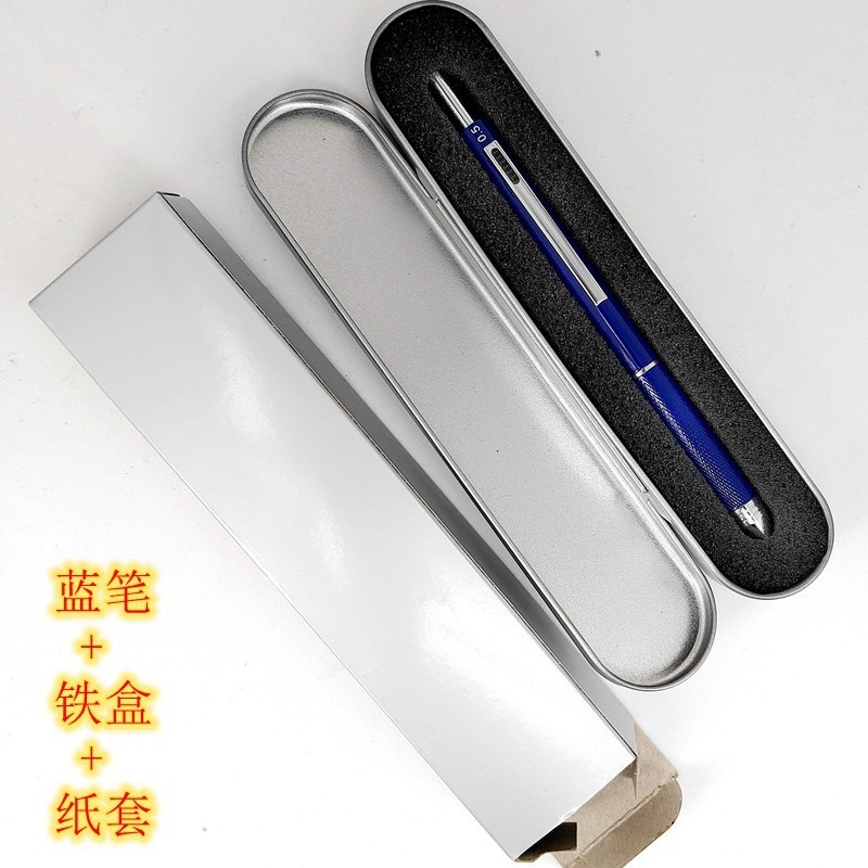 Caja de hierro con bolígrafo azul