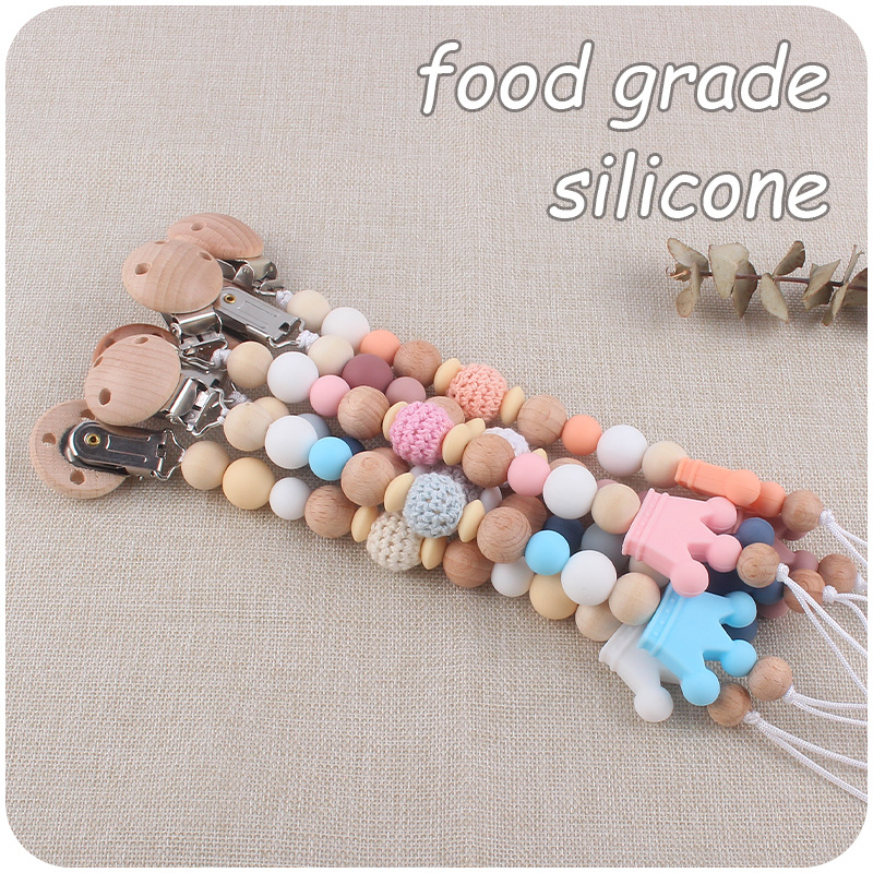 Nuevo bebé suministros Beech chupete clip DIY corona de dibujos animados mordedura de silicona molares chupete cadena anti-caída