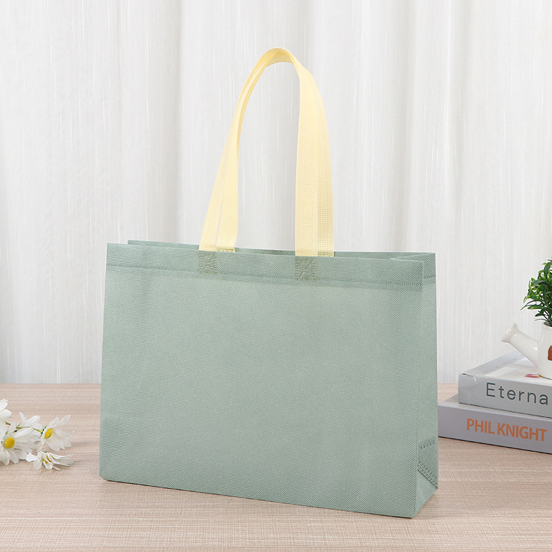 Bolsas de tela no tejida tiendas de souvenirs de viajes de madres y bebés en línea bolsa de compras de mano engrosada bolsa de mano image 8