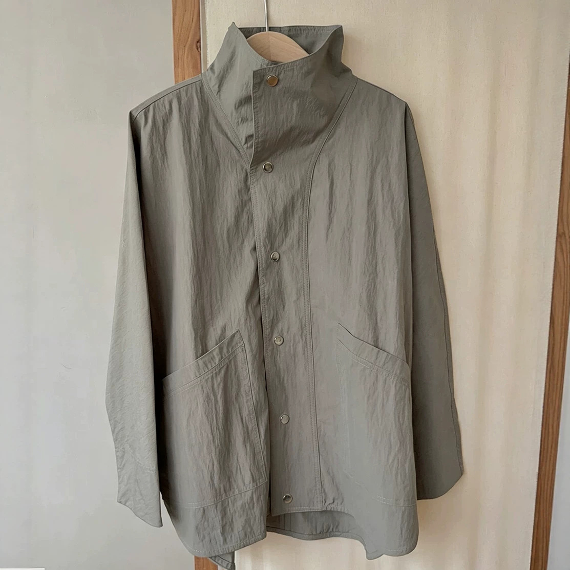 New season, new colors, clean lines, lightweight mid-length jacket/trench coat.