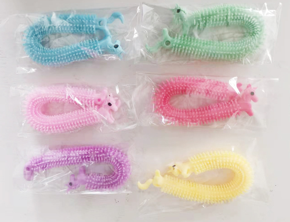 Amazon Venta caliente creativo nuevo dinosaurio Lala descompresión ventilación cuerda dibujos animados alpaca pulsera pull fideos