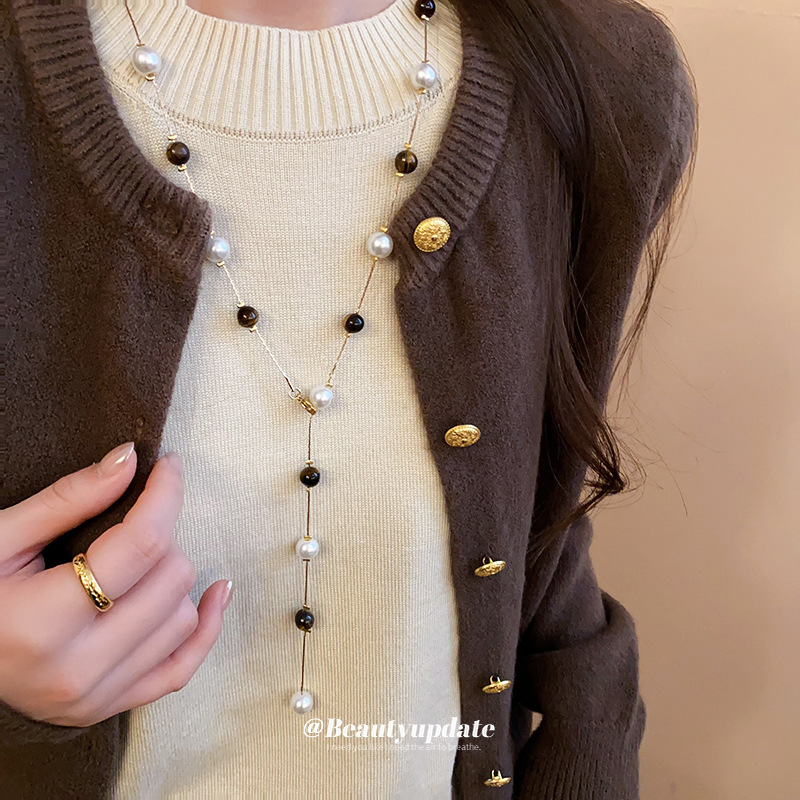 Collar de perlas de piedra de ojo de tigre artificial transfronterizo otoño e invierno cadena de suéter de todo fósforo de nicho accesorios de joyería de moda de alta gama