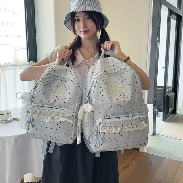 Korean-style ins college-style polka dot high-appearance middle school student backpack, sweet lace soft girl style travel backpack