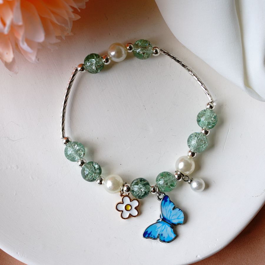 thumbnail image 1 of Nuevo temperamento tocador miel perla explosión flor cristal pulsera nicho femenino diseño japonés y coreano azul mariposa pulsera transfronteriza joyería mariposa uno, 1 of 2