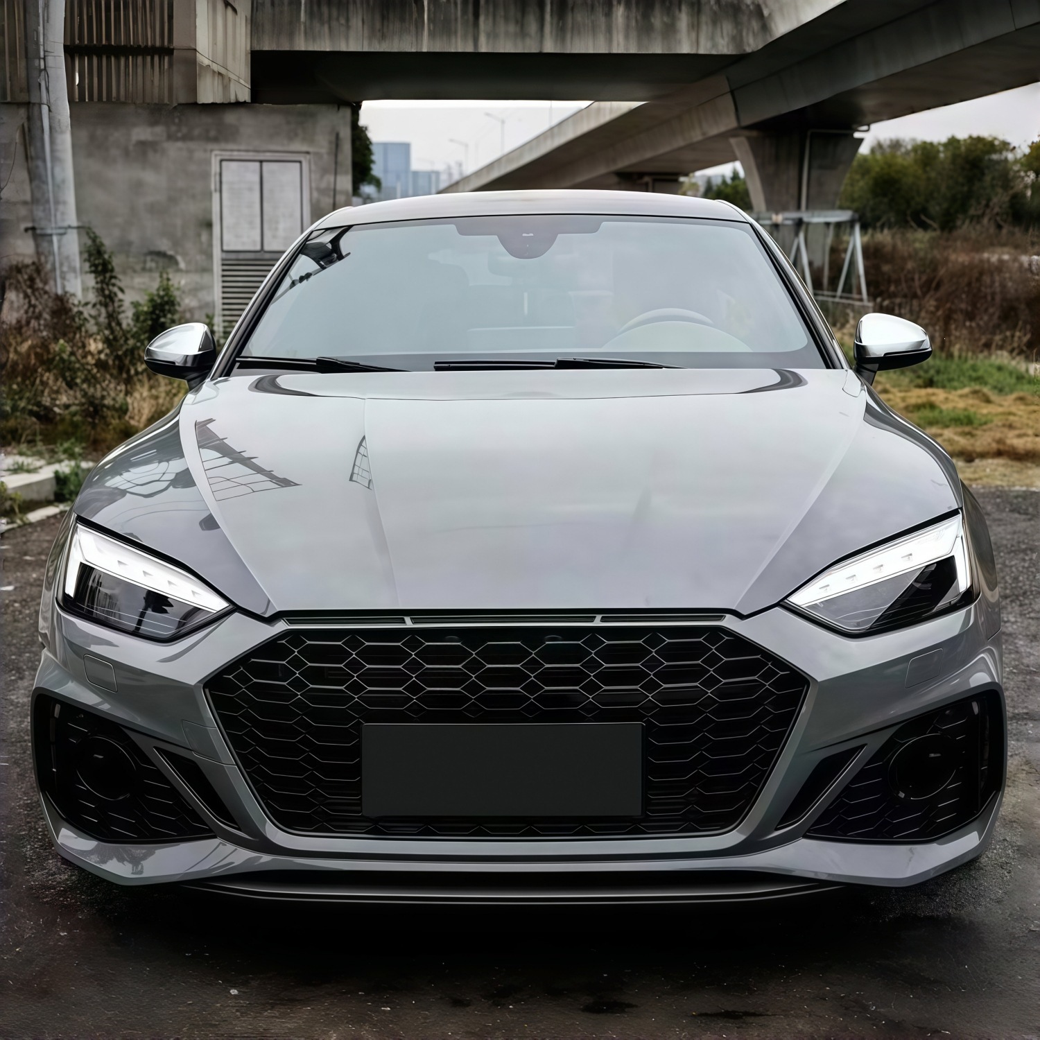 Suitable for Audi A5 2021-2024 models, RS5 rear bumper assembly, rear surround, tail lip, tail throat, and rear lower skirt, in a black finish