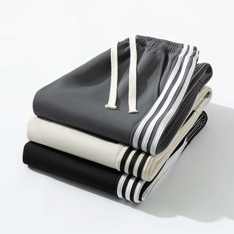 Pantalones deportivos a rayas estadounidenses para hombres y mujeres 2024 pantalones casuales rectos de cintura alta cuerdas sueltas pantalones al por mayor