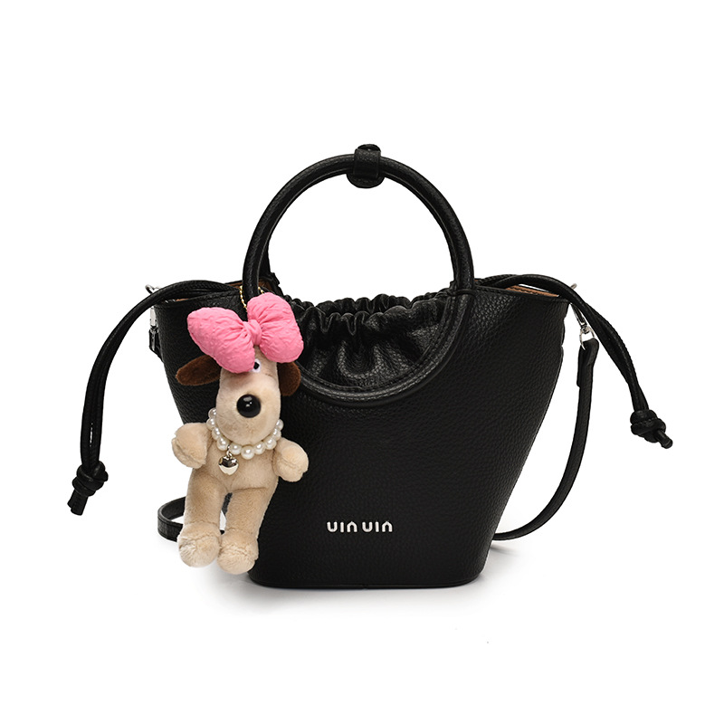 Bolsos de mano de nicho de tendencia transfronteriza para damas 2025 nuevo bolso de hombro simple de moda con textura bolso de cubo de todo fósforo