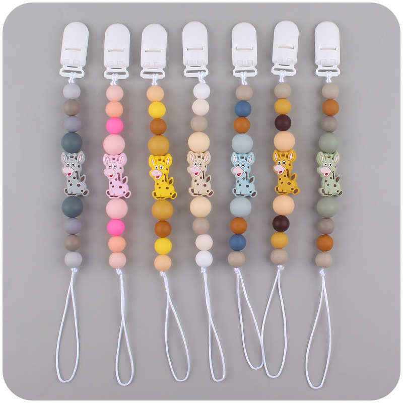 Nuevo bebé suministros chupete cadena creativa de dibujos animados jirafa silicona bebé mordedura cadena anti-caída molar