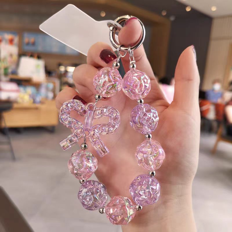 Colgante de teléfono móvil corto colgante de muñeca red rojo patrón delicado arco colgante de cuentas caja de teléfono móvil anti-perdida universal