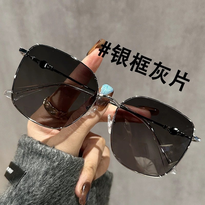 Silver framed gray piece