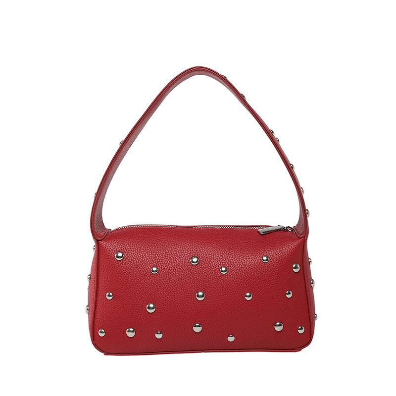 Bolso de axila con textura transfronteriza 2025 verano nuevo bolso femenino bolso de remache personalizado bolso de hombro con patrón de lichi de moda