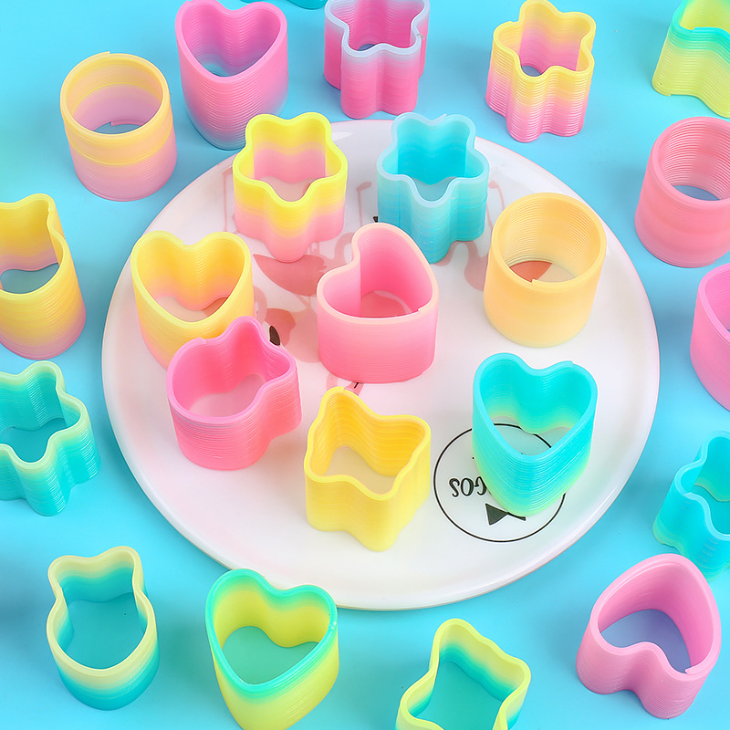Heart-shaped magic rainbow ring mini spring ring telescopic stacking elastic ring to push hot selling small toys gifts wholesale