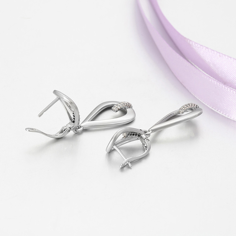 Xuping micro gemas artificiales pendientes geométricos nicho de personalidad transfronteriza europea y americana aleación de cobre chapado en blanco pendientes