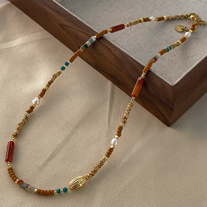 Collar con cuentas de ojo de tigre Maillard Cadena de suéter de otoño e invierno de alta calidad Acero de titanio Cadena de clavícula de piedra natural retro de lujo ligero