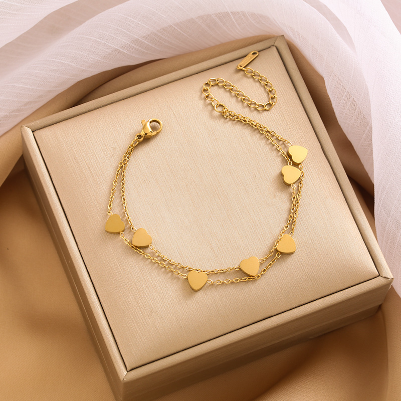 Pulsera de trébol de acero titanium vendedora caliente transfronteriza europea y americana con incrustaciones de concha pulsera colgante pulsera de diseño avanzado sin desvanecimiento al por mayor