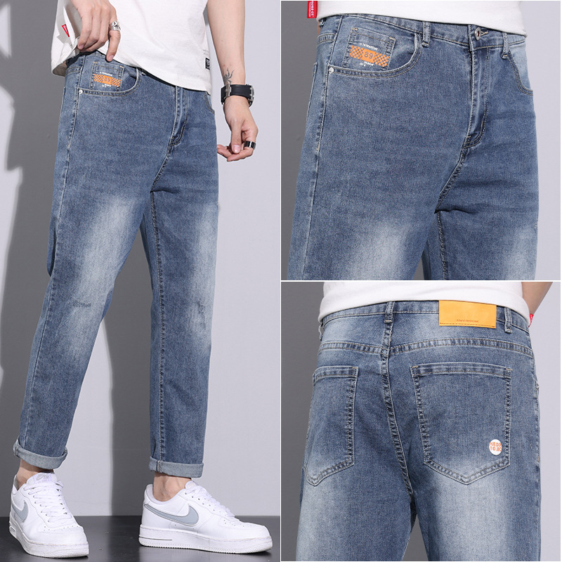 Pantalones vaqueros blancos lavados vintage de la estación europea de los hombres nuevos pantalones largos de los hombres elásticos flojos de moda del todo-fósforo