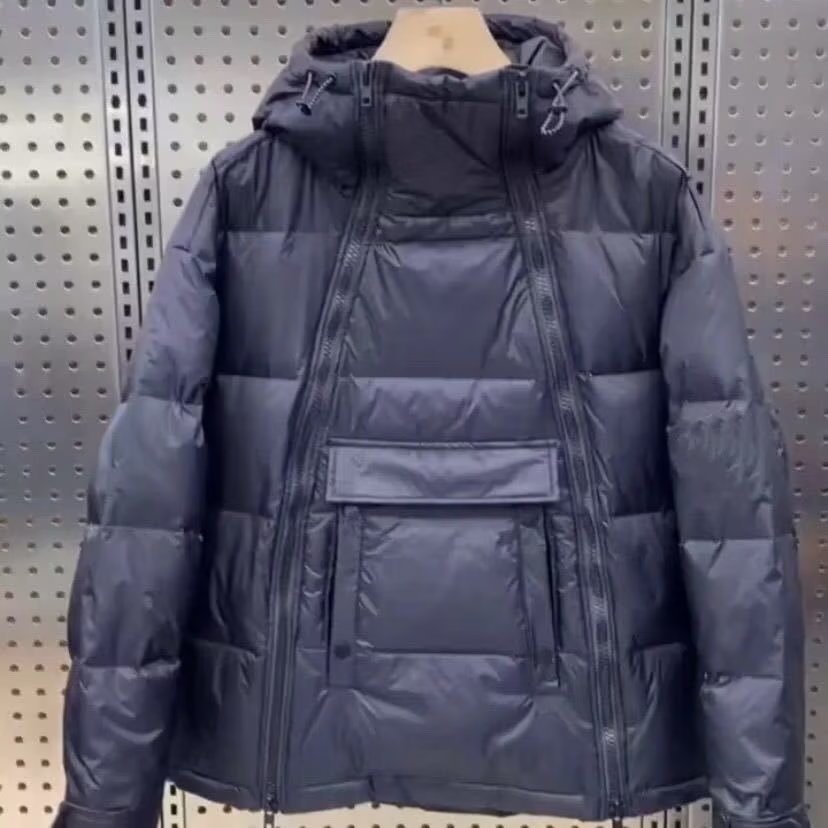 Abrigo de pan con cremallera oblicua de pareja de invierno abrigo cálido con capucha de algodón acolchado abrigo de los hombres de moda celebridad de Internet mismo estilo abrigo negro