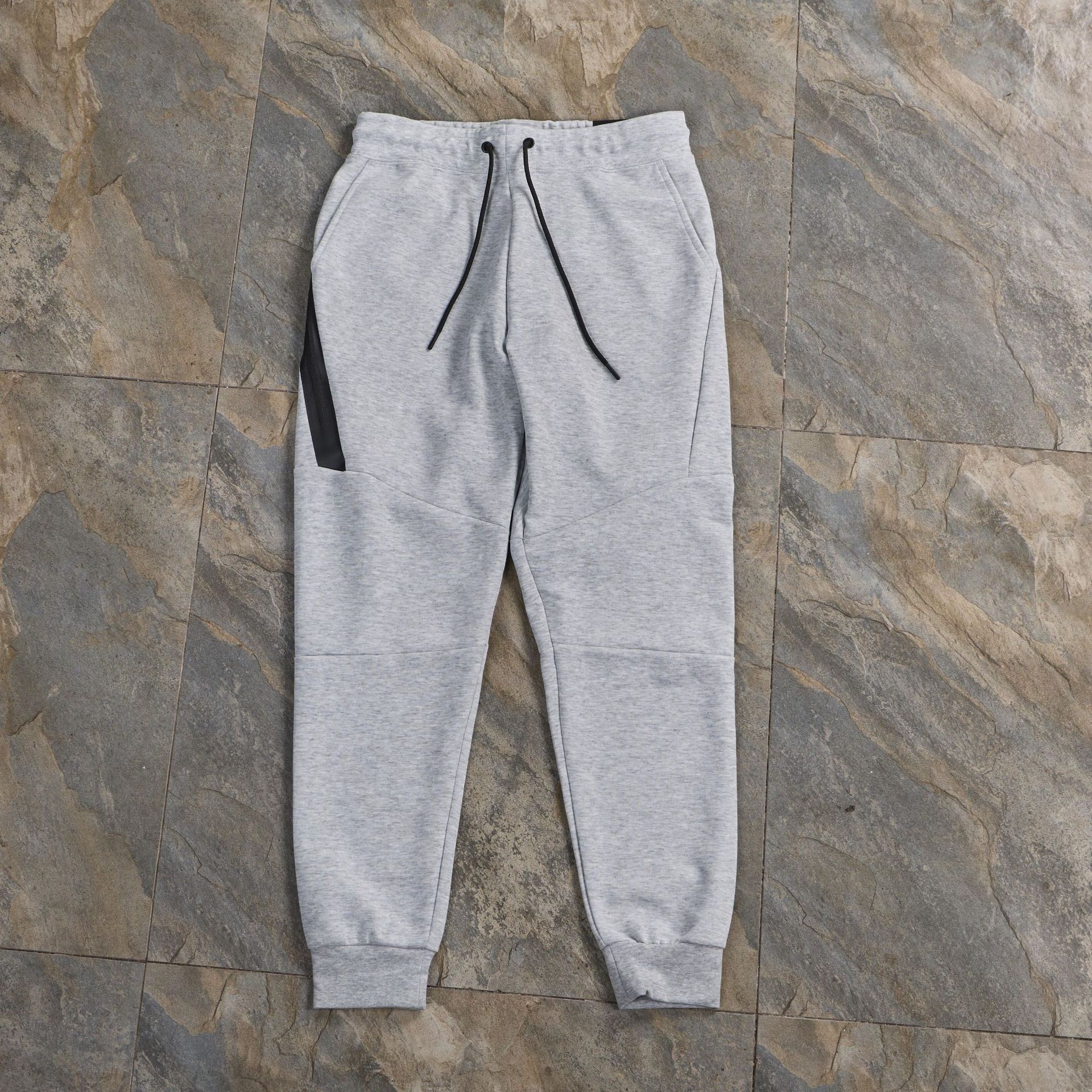 Pantalones deportivos pantalones de costura de primavera y otoño pantalones de ocio deportivo de algodón con capa de aire pantalones delgados con pies con cordón